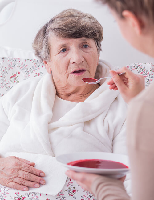 Caregiver feeding client